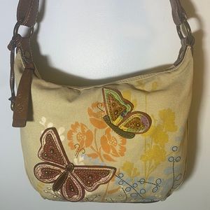 Fossil light tan canvas bag/butterfly appliqués